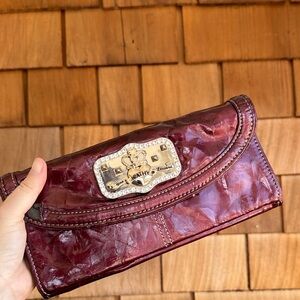 Kathy Van Zeeland Burgundy Patent Clutch with Decorative Plaque